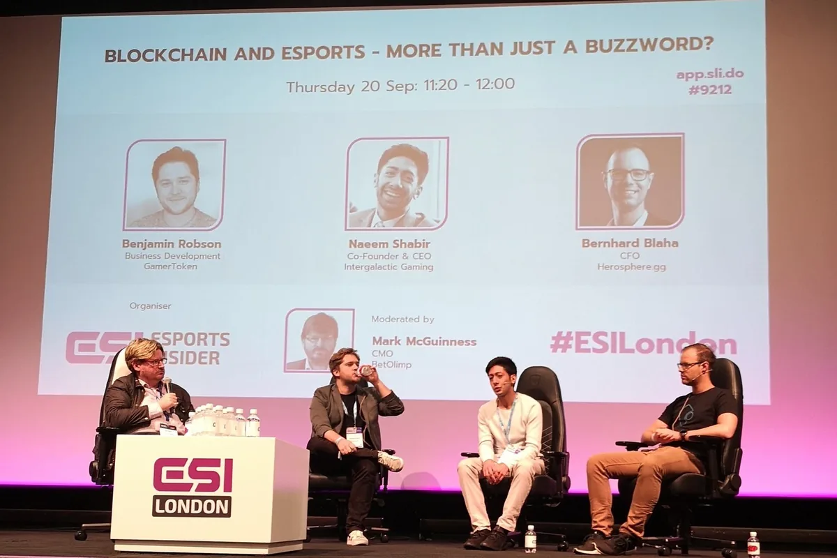 Panel on stage at ESI London under a slide titled Blockchain and esports: more than just a buzzword?